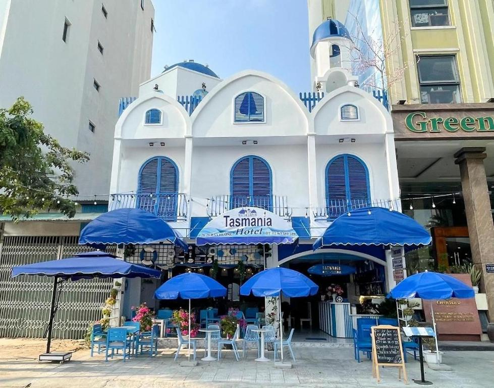 The blue-and-white façade of TNJ Tasmania Hotel & Café